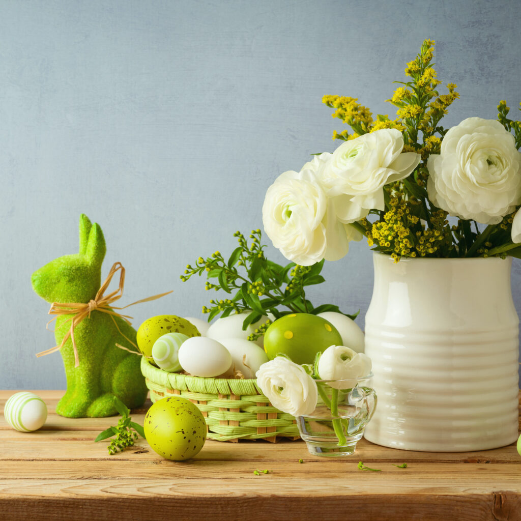 Easter holiday concept with beautiful flowers bouquet and Easter eggs on wooden table