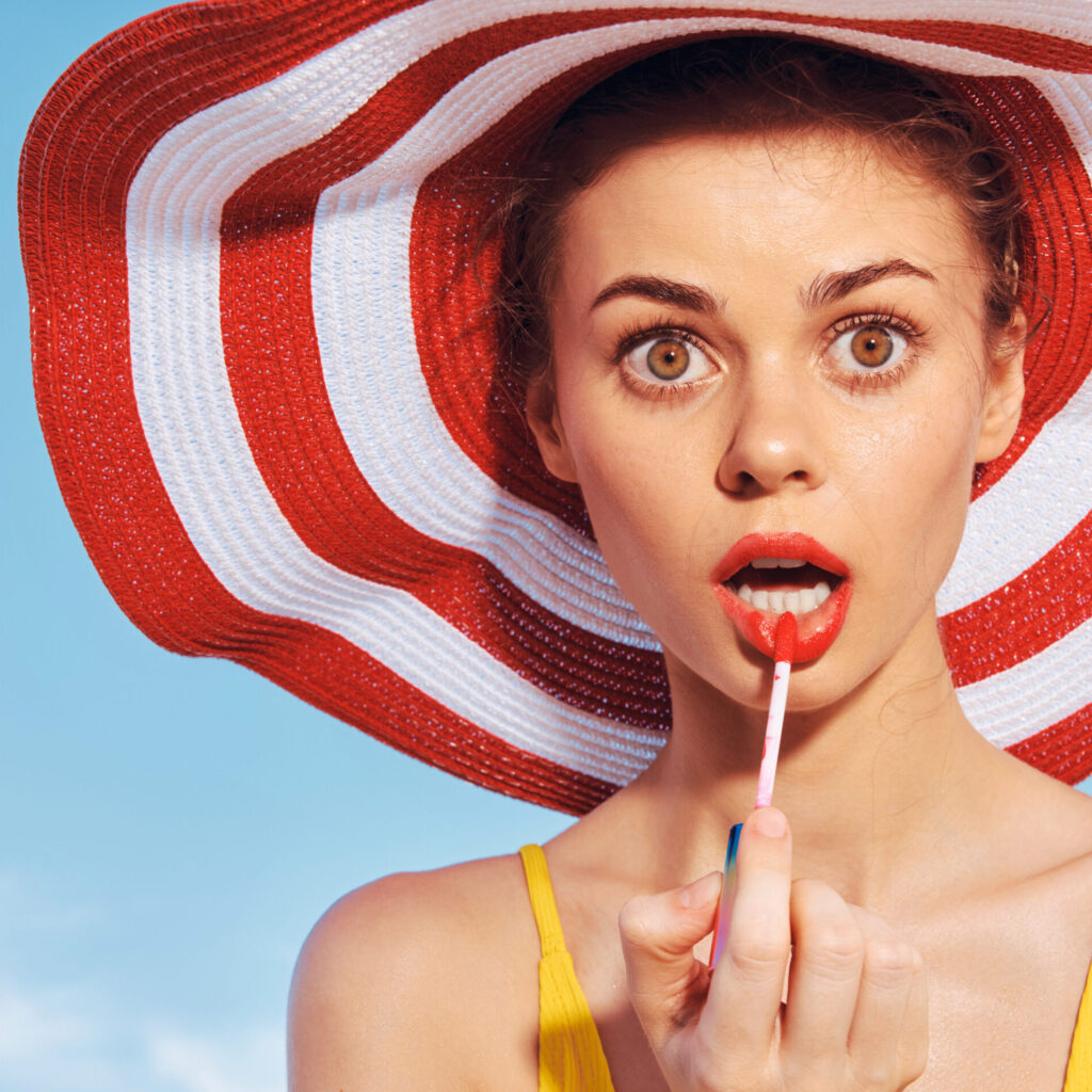 lip balm spf young-woman-applying-lipstick
