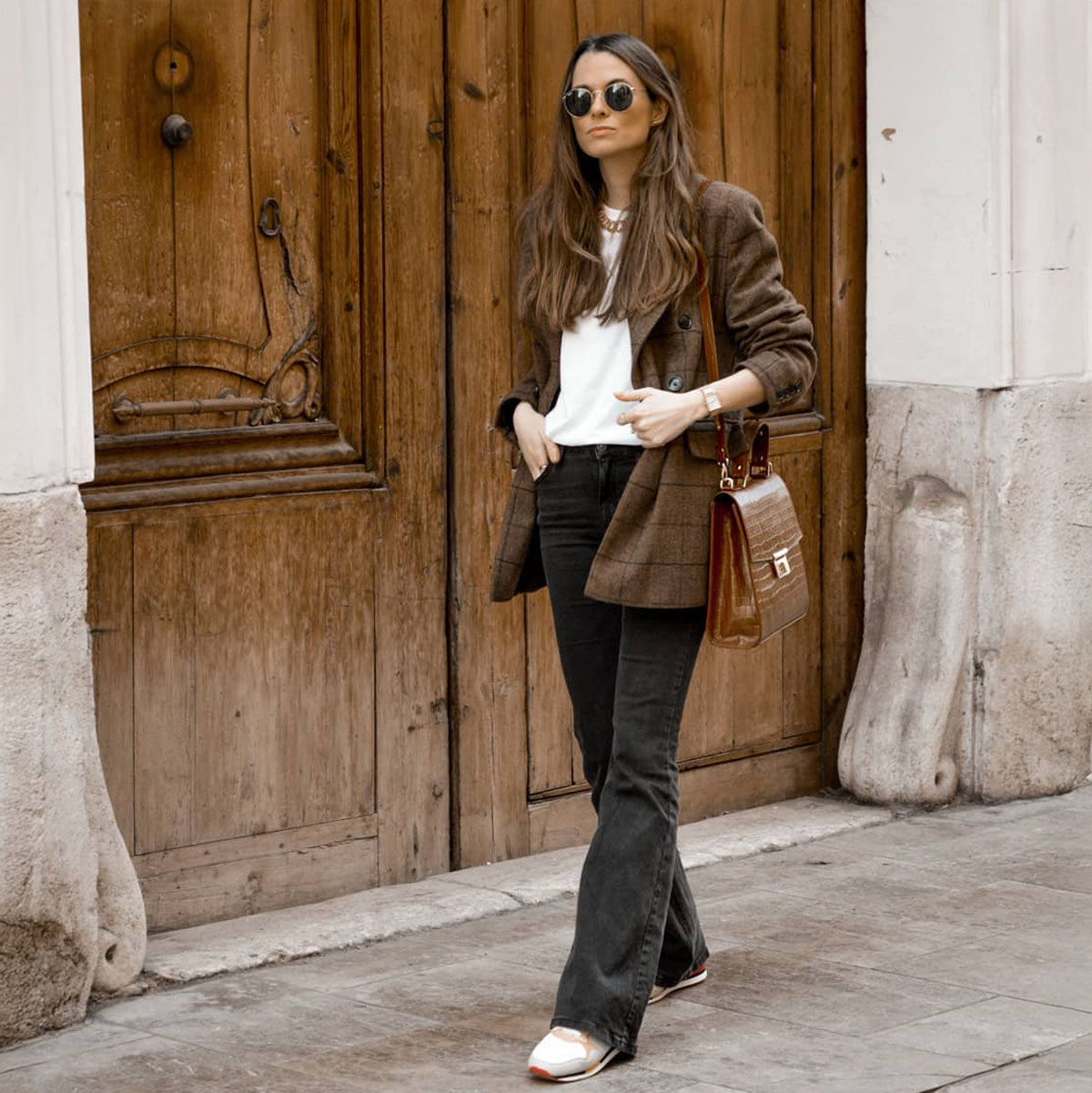 woman wearing flare jeans in winter