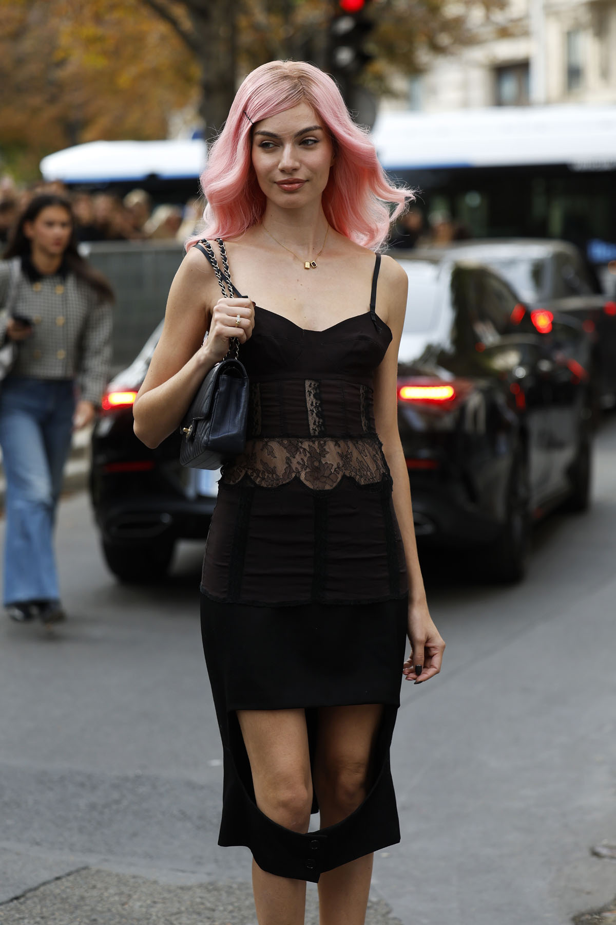  Mara Lafontan wears brown and black midi dress with lace sheer detail on the waist and big cut out on the bottom part, black Chanel bag, outside Carven, during the Womenswear Spring Summer 2026 as part of Paris Fashion Week on October 02, 2025 in Paris, France. )