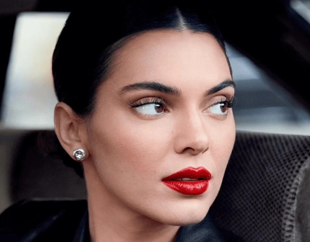 2025-loreal-consumer-products-division-woman-in-red-lipstick-in-black-coat copy