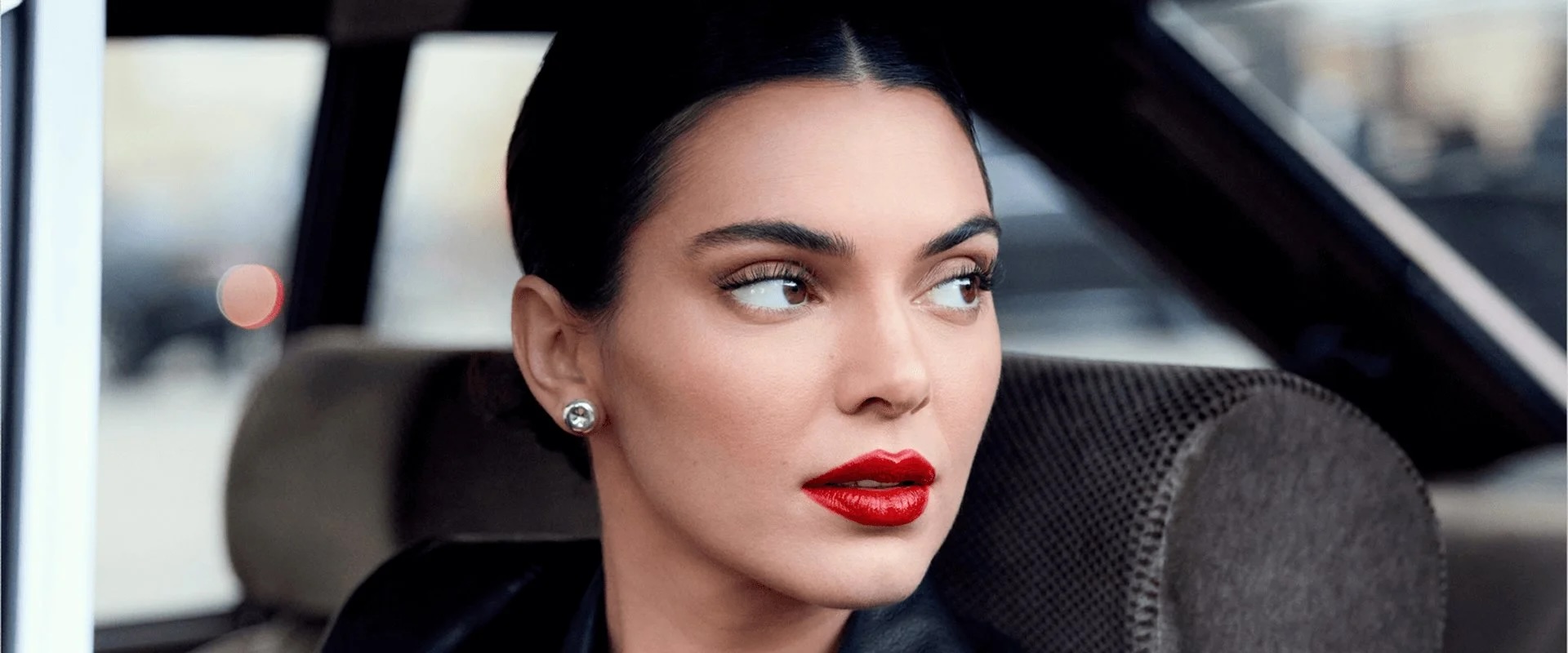 2025-loreal-consumer-products-division-woman-in-red-lipstick-in-black-coat copy