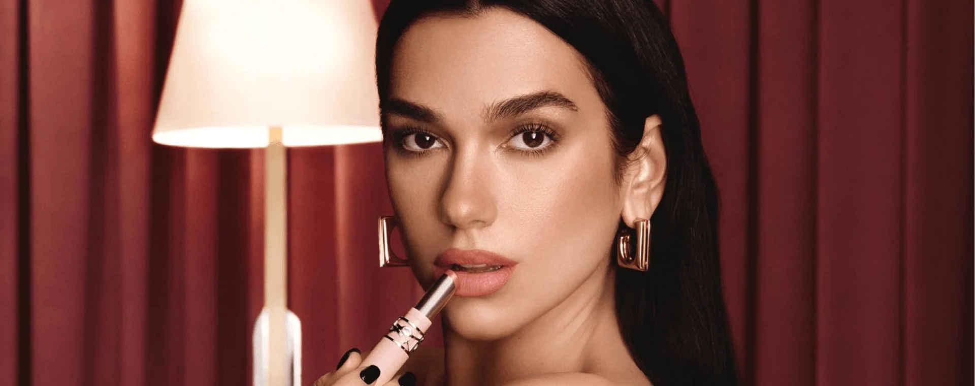2026-luxe-division-brand-ysl-beauty-dua-lipa-applying-lipstick-hero-banner-desktop copy